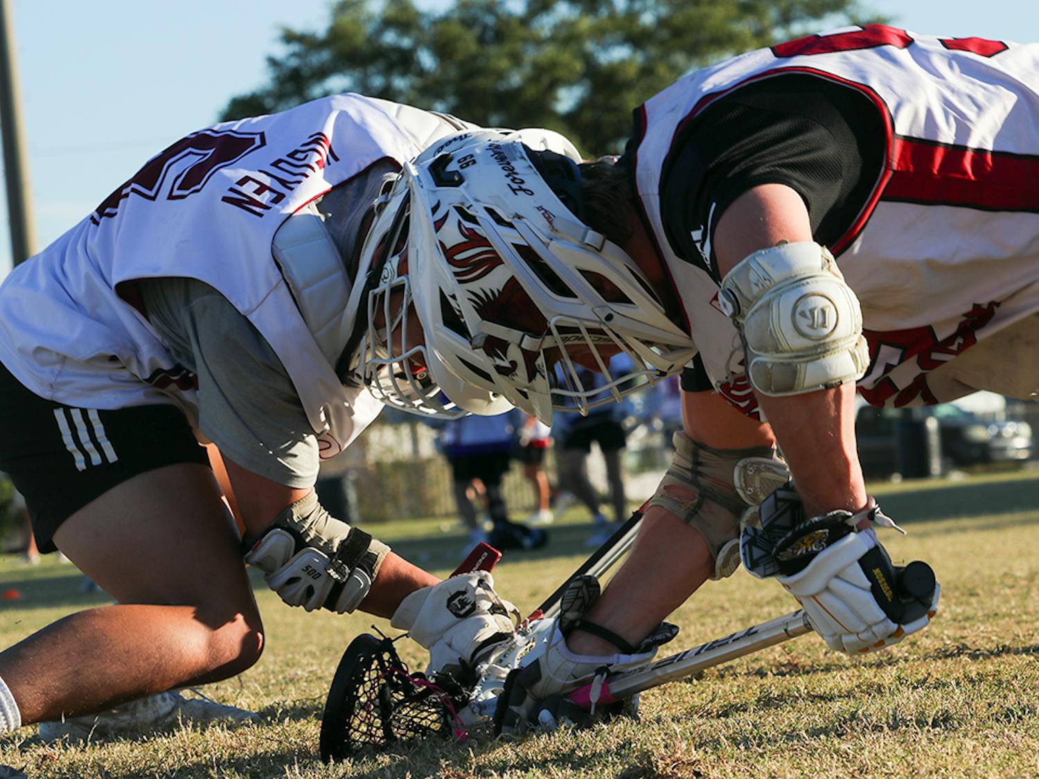 Senior South Carolina men's club lacrosse president Kevin Nguyen practices face-offs against senior Will Frith at the University of South Carolina – Sport’s Club Field on Oct. 5, 2022. The club team plays its first game against James Madison in February 2023.&nbsp;