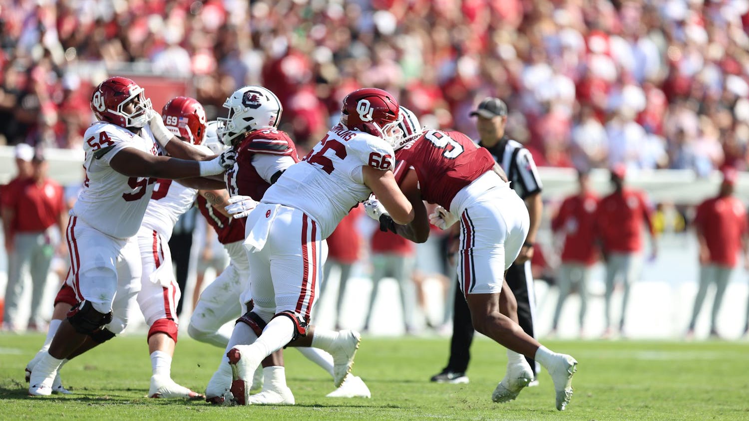 A group of players collide in a fight for the ball. The South Carolina Gamecocks played against the Oklahoma Sooners in the afternoon on Saturday, Oct. 18, 2025, at Williams-Brice Stadium. 