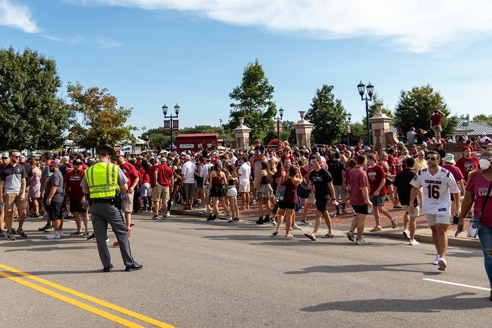 Gamecock fans stop traffic on Bluff Road between Williams-Brice Stadium and Gamecock Park for Gamecock Walk.