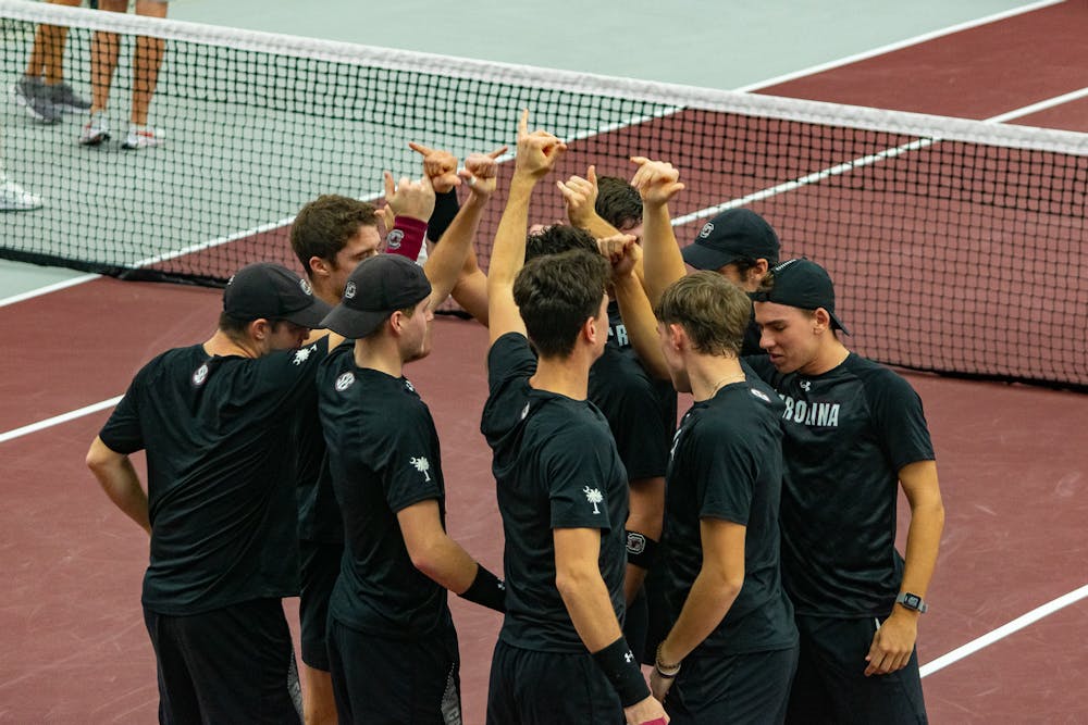 <p>The Men's Tennis team end their team huddle preparing for their matchups on Feb. 4, 2022. The team will face their first ranked opponent, Wake Forest, on Feb. 10.</p>