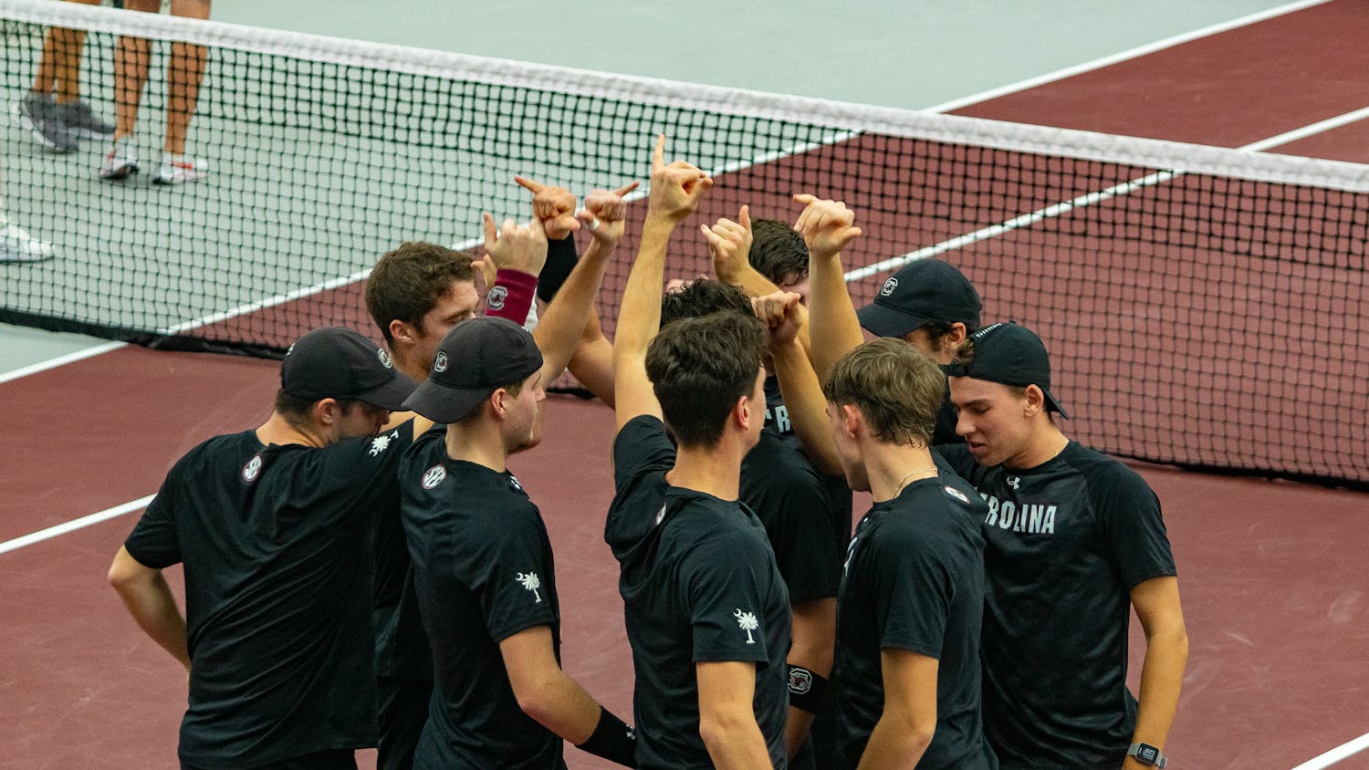 The Men's Tennis team end their team huddle preparing for their matchups on Feb. 4, 2022. The team will face their first ranked opponent, Wake Forest, on Feb. 10.
