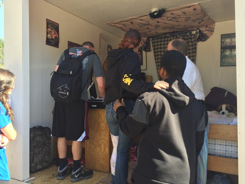 Students were tasked with pointing out common fire hazards in a mock dorm room set up on Greene Street.