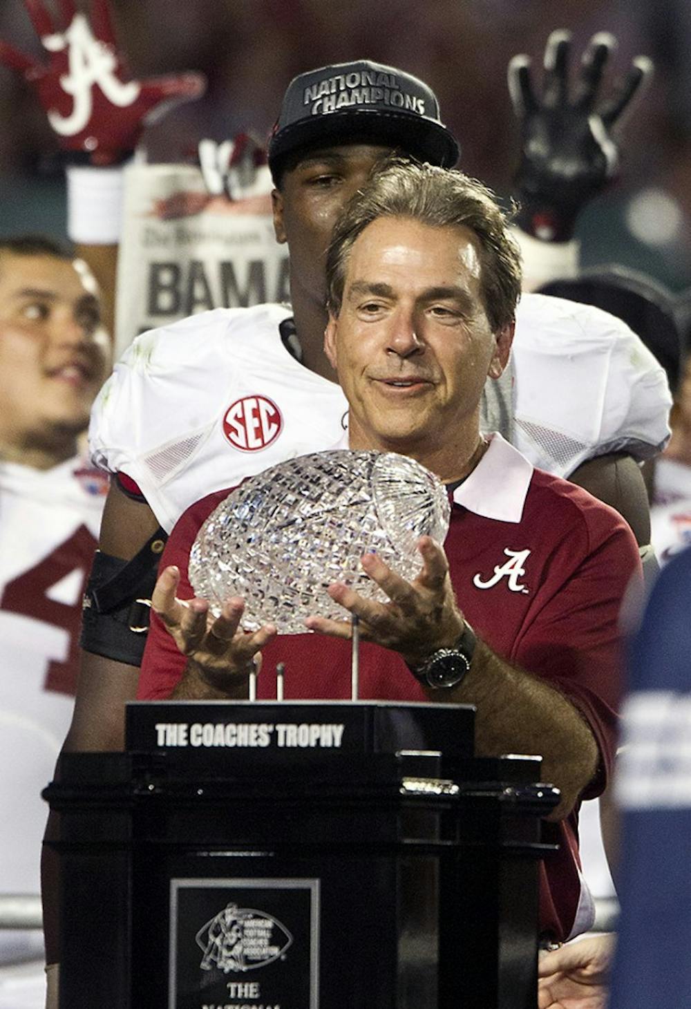 Alabama head coach Nick Saban hoists the trophy following a 42-14 win against Notre Dame in the BCS National Championship game at Sun Life Stadium on Monday, January 7, 2013, in Miami Gardens, Florida. (C.W. Griffin/Miami Herald/MCT)