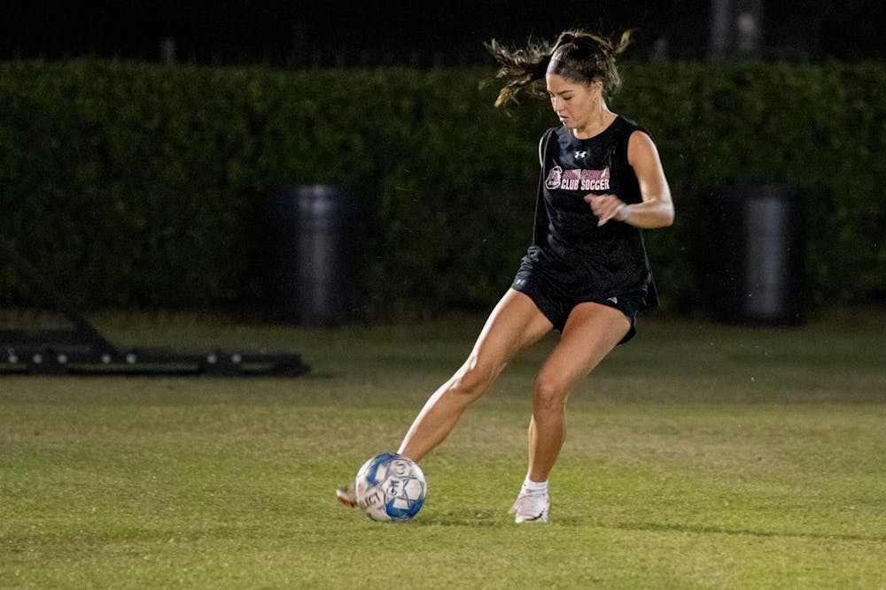 <p>Fourth-year criminal justice and psychology student Juliet Ballard prepares to pass the ball during women's club soccer practice on Oct. 26, 2023. This year is the first time in club history that the Gamecocks are participating in the National Intramural and Recreational Sports Association National Soccer Championships.</p>
