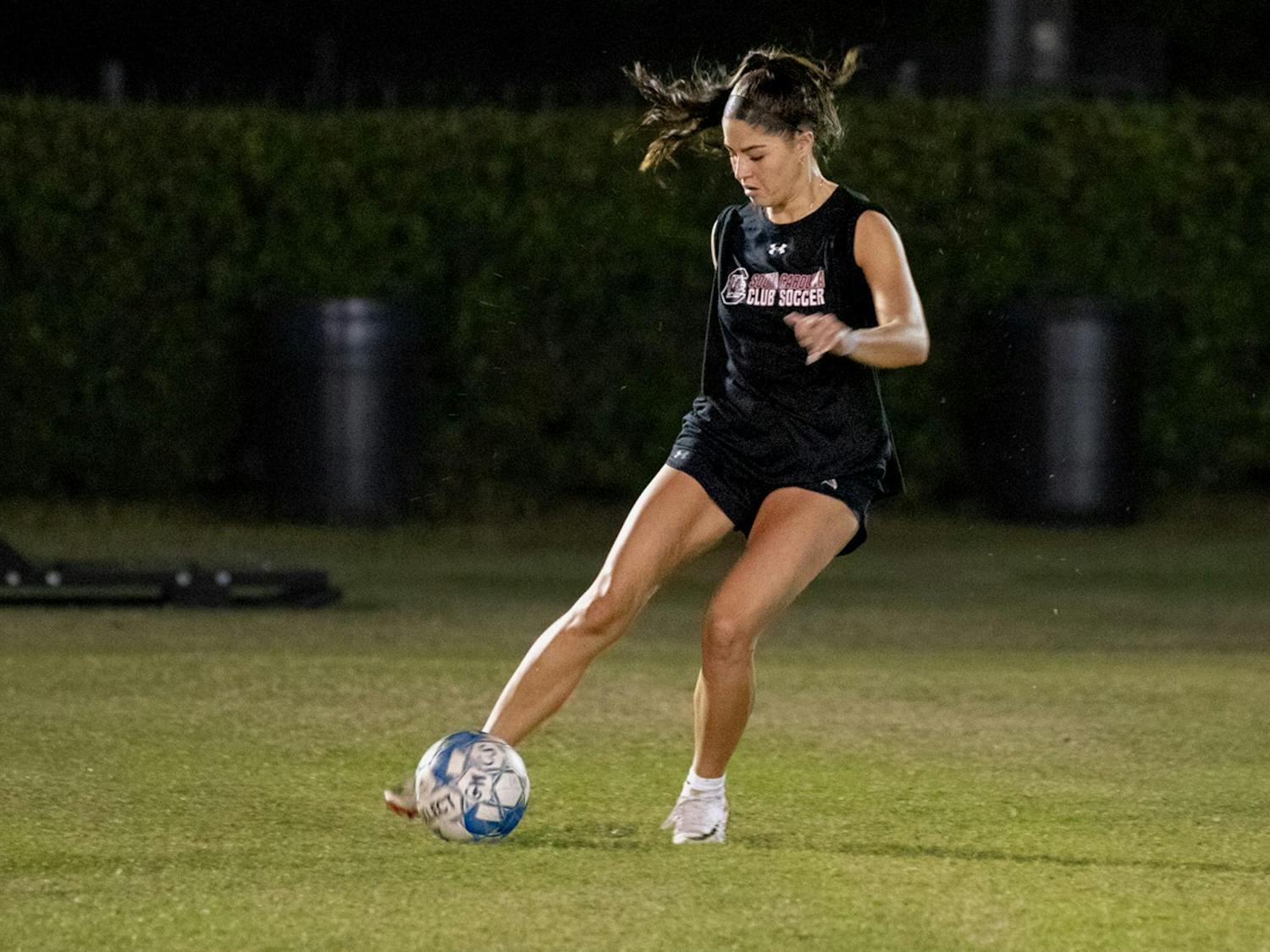 Fourth-year criminal justice and psychology student Juliet Ballard prepares to pass the ball during women's club soccer practice on Oct. 26, 2023. This year is the first time in club history that the Gamecocks are participating in the National Intramural and Recreational Sports Association National Soccer Championships.