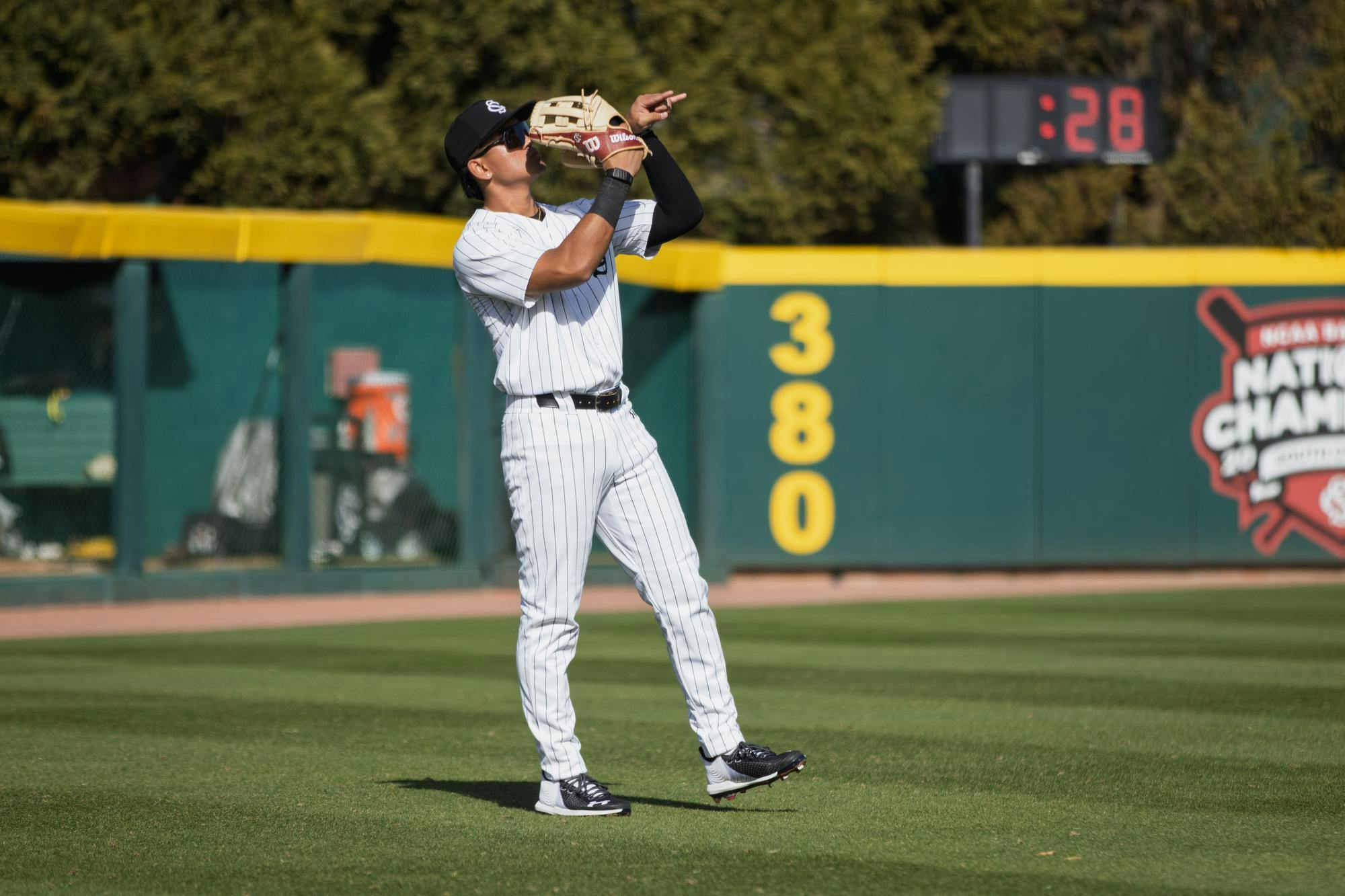 Senior outfielder Ethan Lizama celebrating after a strikeout from junior pitcher Brandon Stone during a game against Northern Kentucky on Feb. 14, 2026, at Founders Park. Lizama has a perfect fielding percentage on the year.