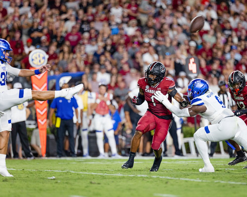 <p>Sophomore Redshirt Running Back Marshawn Lloyd attempts to stop a punt from Redshirt Junior Place-kicker punter Michael Hayes during the game against Georgia State on September 3, 2022. The Gamecocks beat the Panthers 35-14.</p>