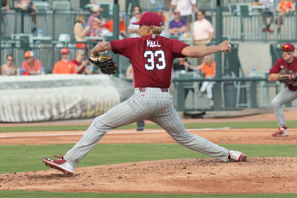 <p>FILE— Junior pitcher Noah Hall throws a pitch in the second inning on March 5, 2022. The Gamecocks fell 10-2 in the second game of the series against Clemson.&nbsp;</p>