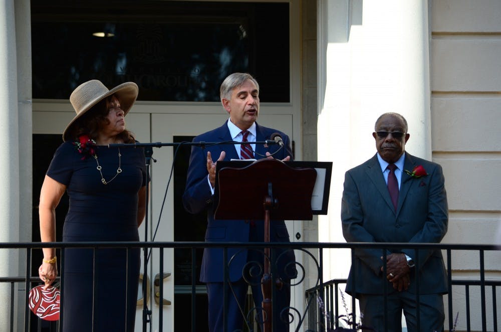 	<p>University President Harris Pastides addresses a large crowd gathered in front of the iconic location at the Osborne Administration Building where Henrie Monteith Treadwell, James Solomon Jr. and Robert Anderson first enrolled at the university.</p>