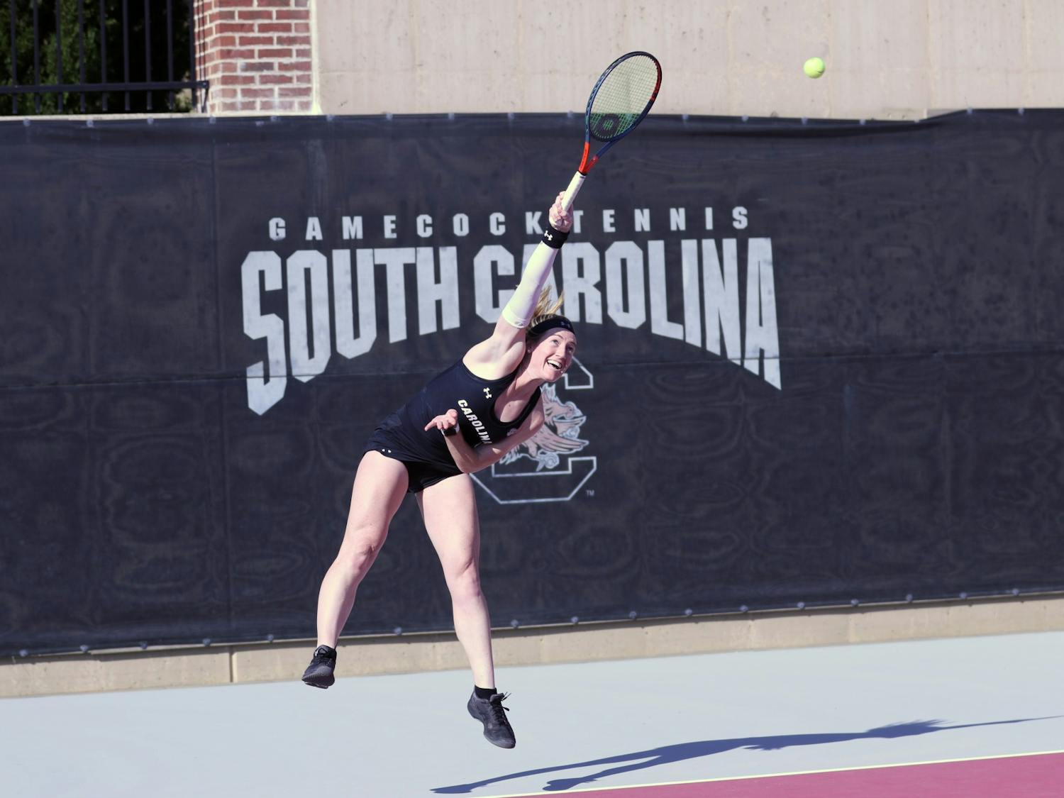 Gamecock freshman Emma Shelton runs to hit a shot during her match against Clemson on Jan. 30, 2020. Overall, the Gamecocks defeated Clemson 6-1.