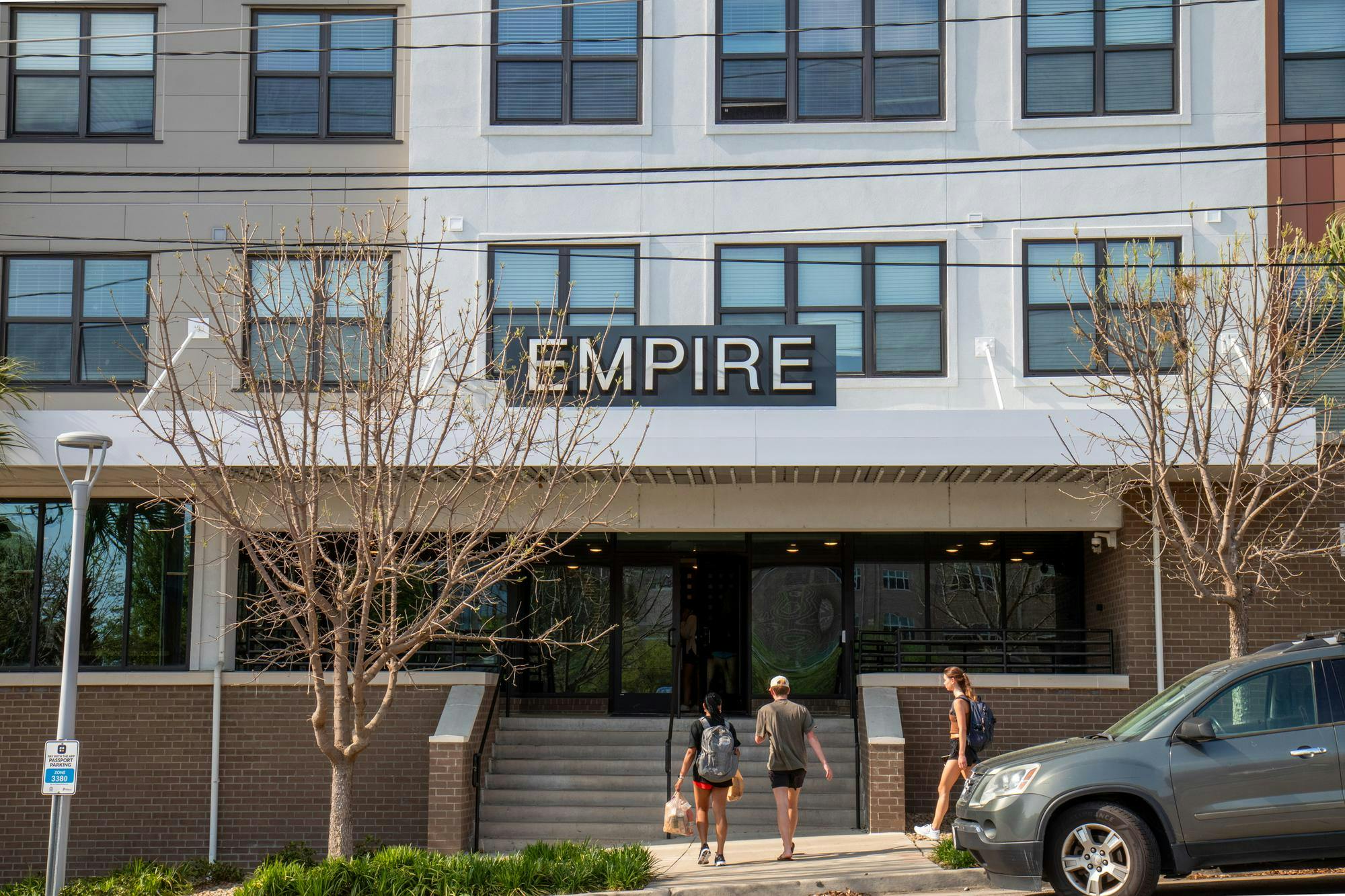 Residents of Empire Columbia enter the lobby of the apartment complex on Apr. 2, 2024. The apartment complex has seven employees on its maintenance staff. According to several residents, Turnaround time for most repairs is a week or less.