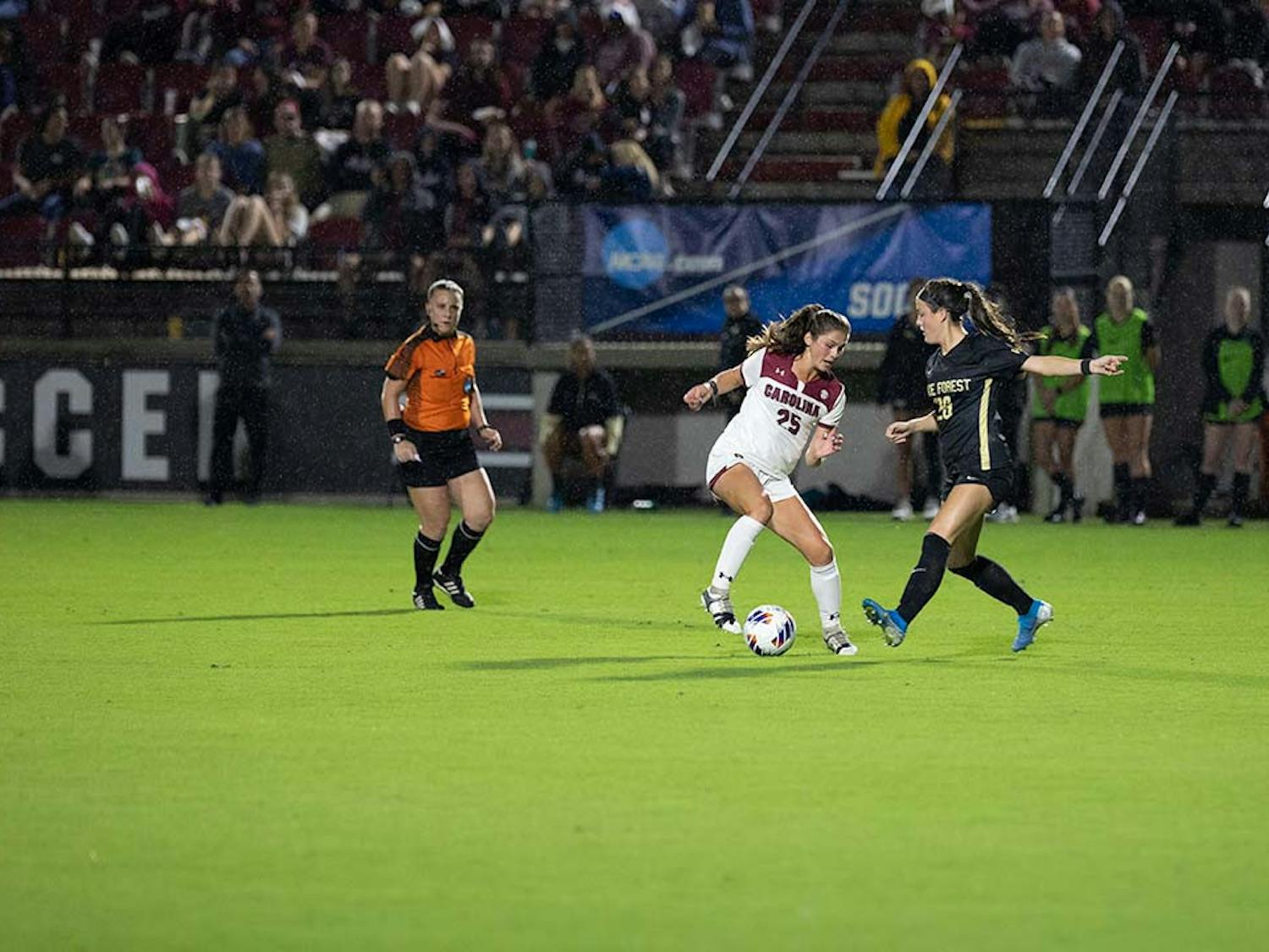 With minutes left on the clock closing in on the end of the first half, sophomore midfielder Lily Render keeps hold of the ball from the Wake Forest player. By the end of the first half, the Gamecocks had scored one goal making the game 1-0 against Wake Forest at Stone Stadium on Nov. 12, 2022.