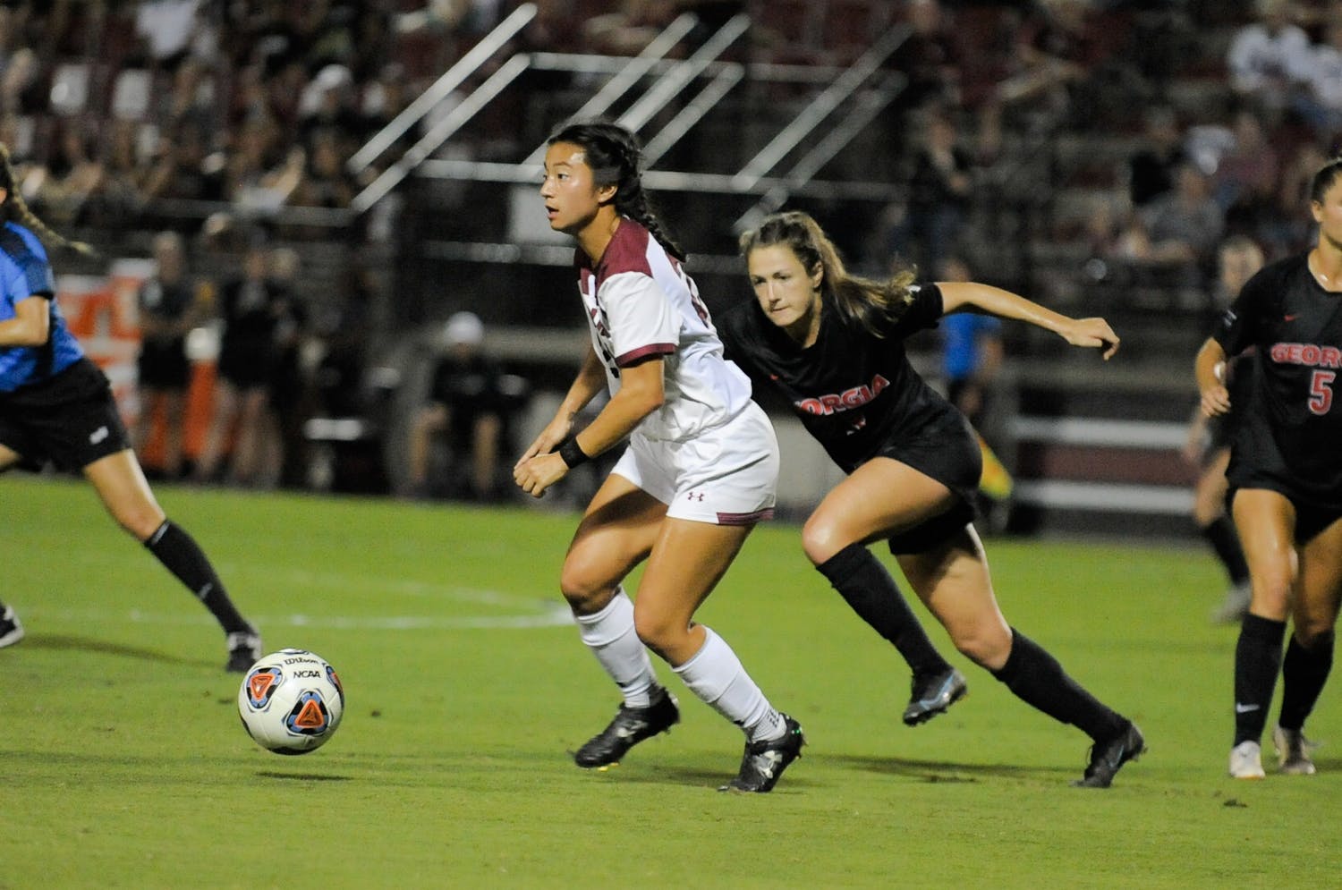 FILE—Graduate midfielder Lauren Chang looks down the field to pass to her teammate during a game against Georgia on Oct. 15, 2021. South Carolina tied with Georgia 0-0.&nbsp;