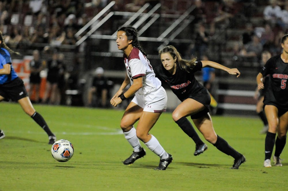 <p>FILE—Graduate midfielder Lauren Chang looks down the field to pass to her teammate during a game against Georgia on Oct. 15, 2021. South Carolina tied with Georgia 0-0.&nbsp;</p>