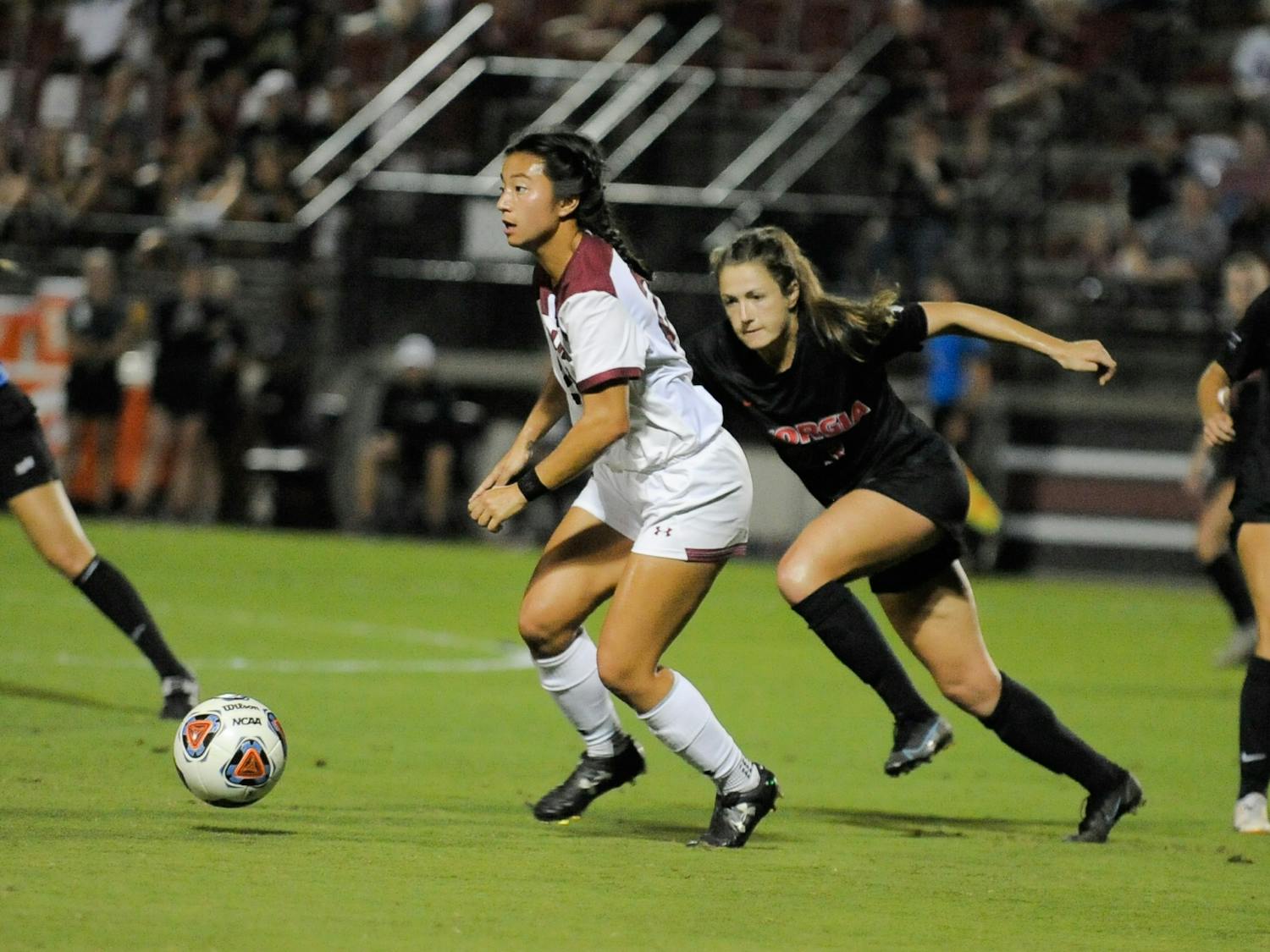 FILE—Graduate midfielder Lauren Chang looks down the field to pass to her teammate during a game against Georgia on Oct. 15, 2021. South Carolina tied with Georgia 0-0. 