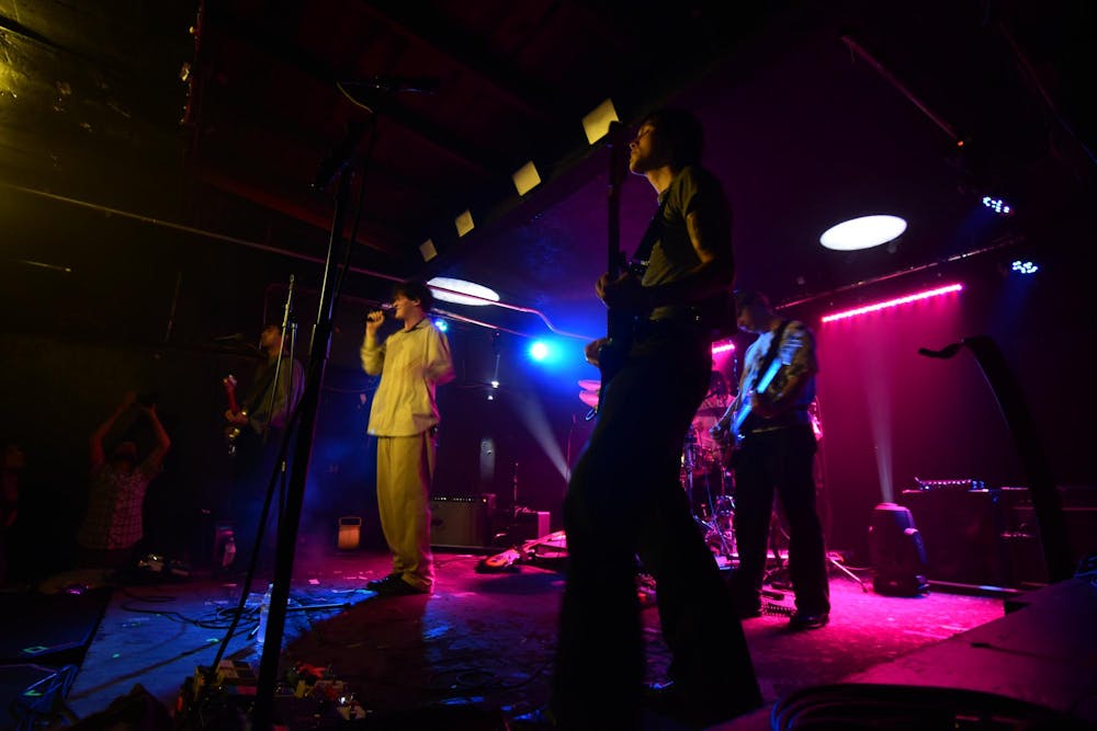 <p>Alt-rock indie band Quarters of Change performs at New Brookland Tavern on Oct. 3, 2023. Lead singer Ben Roter sings "Blue Copper" with bandmates Ben Acker, Attila Anrather and Jasper Harris.</p>