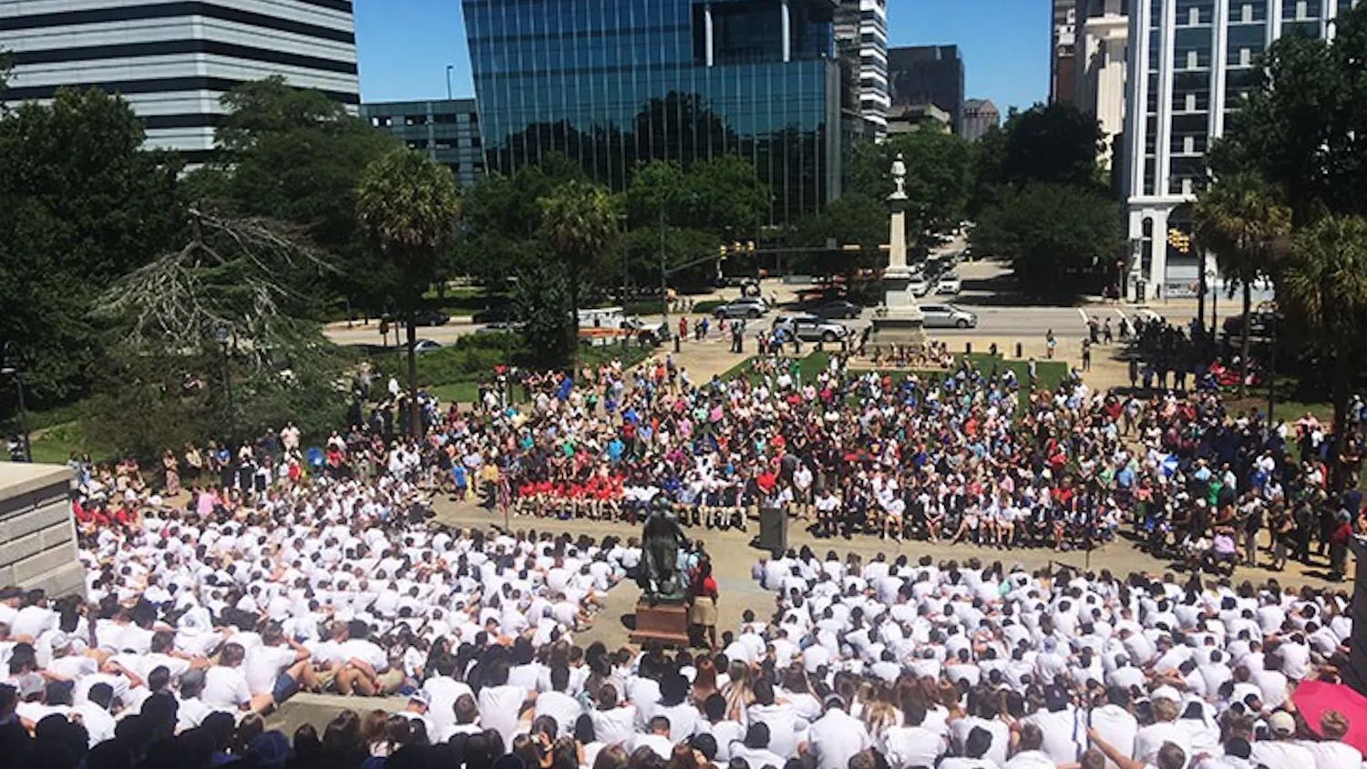  The boys of Palmetto Boys State sit on the steps of the South Carolina Statehouse, where they are attending an assembly after parading from Main Street to the Statehouse. 