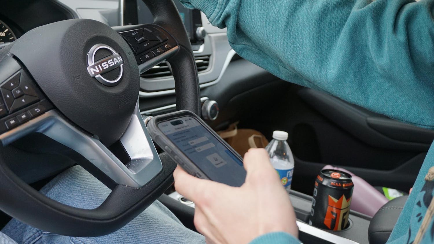 A USC student is driving while on his phone at Barnwell Street on Feb. 25, 2026. South Carolina passed a hands-free driving law, which will allow law enforcement to issue warnings and citations for violating the law.