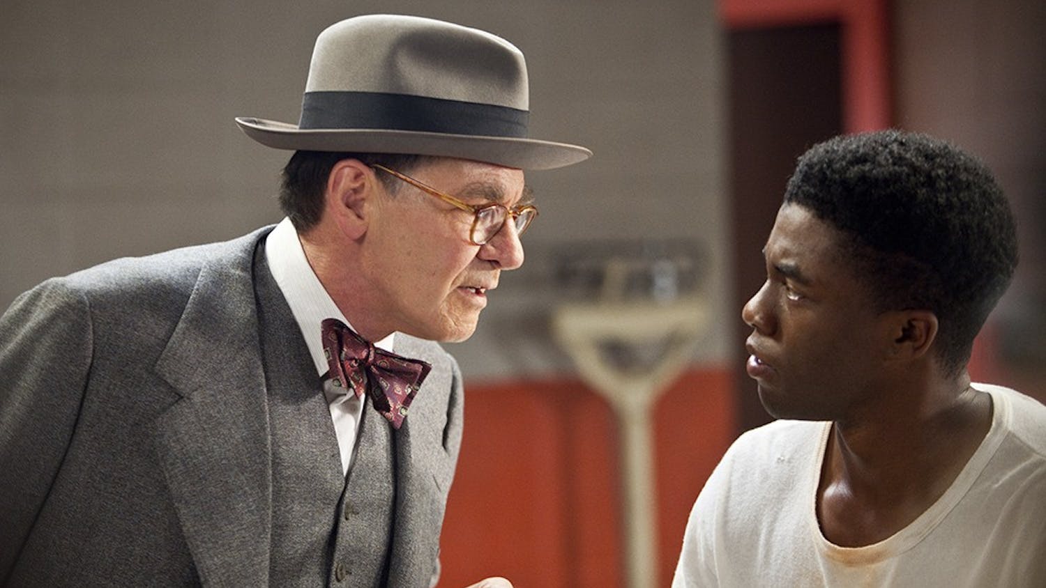 Harrison Ford, left, as Branch Rickey and Chadwick Boseman (right) as Jackie Robinson are seen in Warner Bros. Pictures and Legendary Pictures drama &quot;42,&quot; a Warner Bros. Pictures release. (D. Stevens/Warner Bros/MCT)