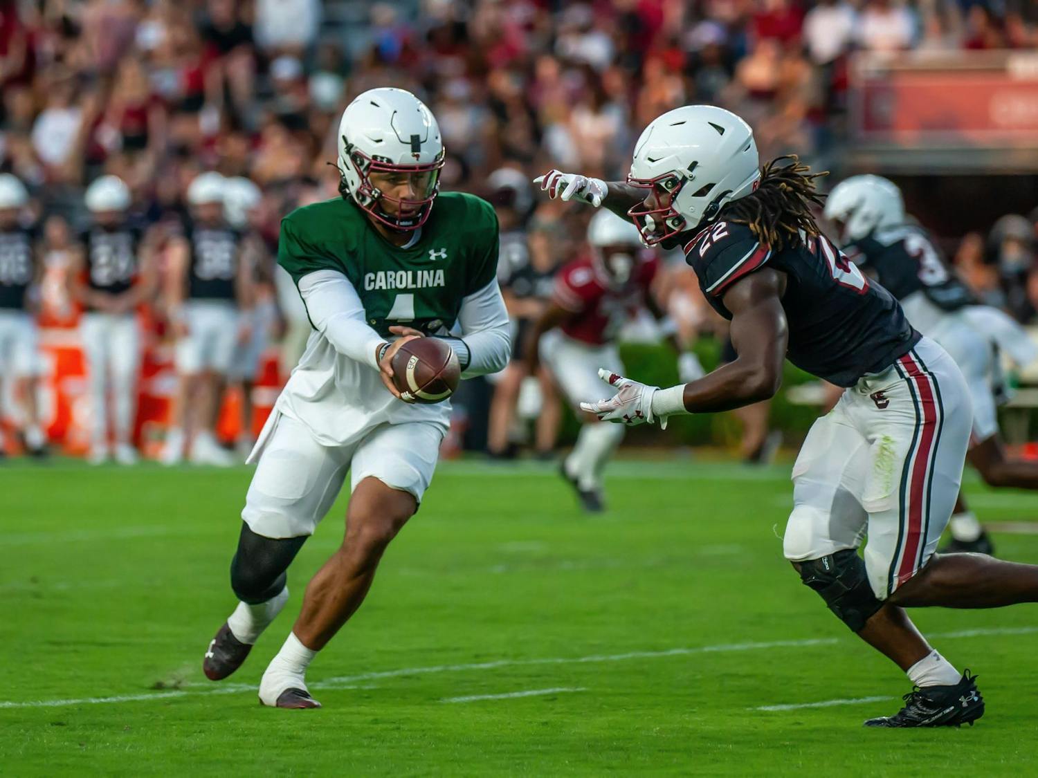 Redshirt senior quarterback Robby Ashford looks to sophomore running back Jawarn Howell for the handoff during the 2024 Garnet & Black Spring Game at Williams-Brice Stadium on April 20, 2024. Ashford enters his fifth year of eligibility after transferring from Auburn where he competed for the last two seasons.