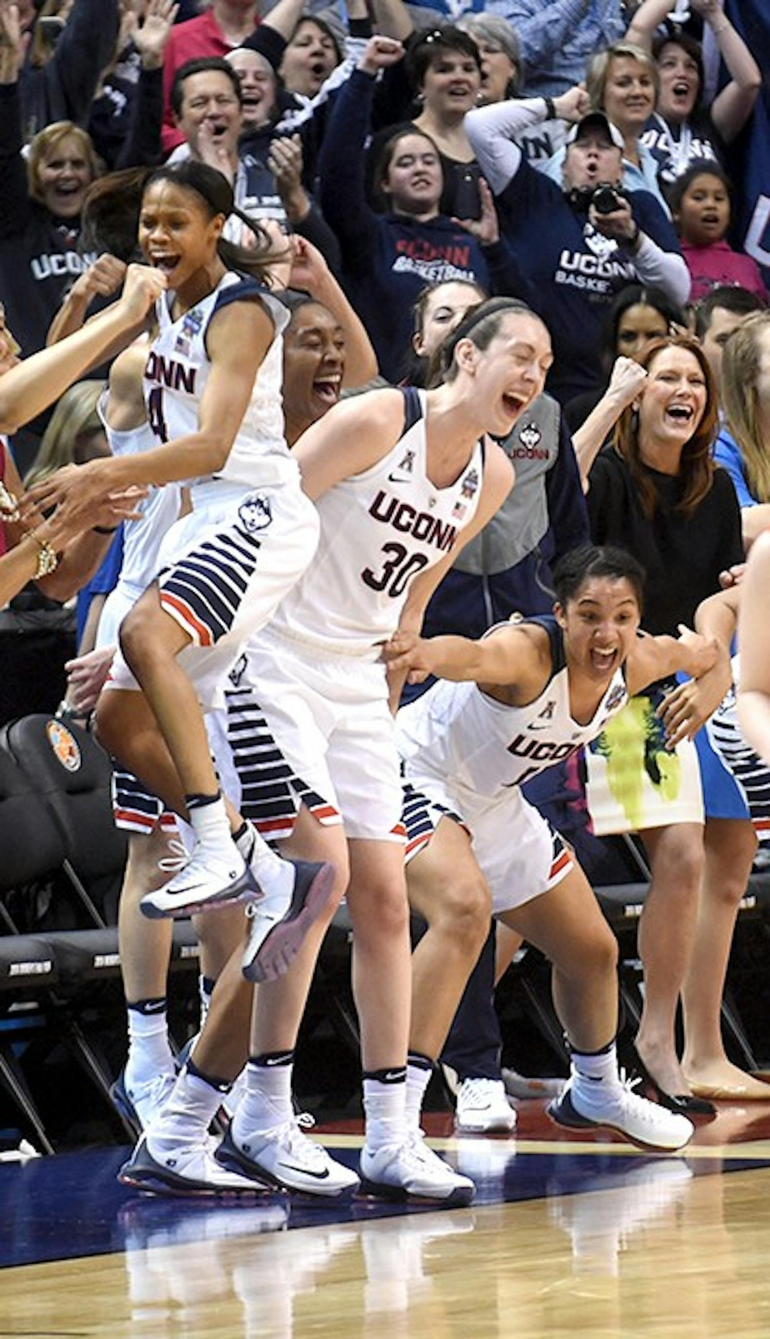 Connecticut Huskies players Moriah Jefferson, from left, Breanna Stewart, Morgan Tuck and Gabby Williams celebrate a basket on Tuesday, April 5, 2016, at Bankers Life Fieldhouse in Indianapolis. (Brad Horrigan/Hartford Courant/TNS)