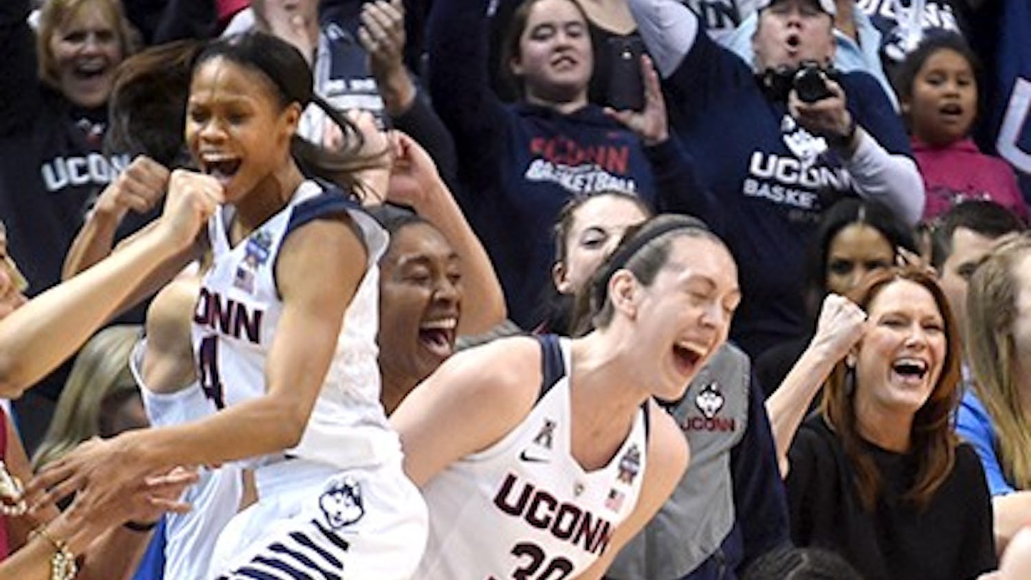 Connecticut Huskies players Moriah Jefferson, from left, Breanna Stewart, Morgan Tuck and Gabby Williams celebrate a basket on Tuesday, April 5, 2016, at Bankers Life Fieldhouse in Indianapolis. (Brad Horrigan/Hartford Courant/TNS)