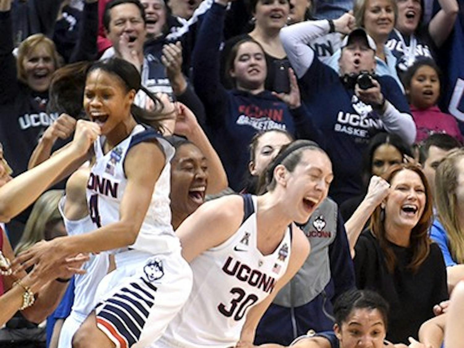 Connecticut Huskies players Moriah Jefferson, from left, Breanna Stewart, Morgan Tuck and Gabby Williams celebrate a basket on Tuesday, April 5, 2016, at Bankers Life Fieldhouse in Indianapolis. (Brad Horrigan/Hartford Courant/TNS)