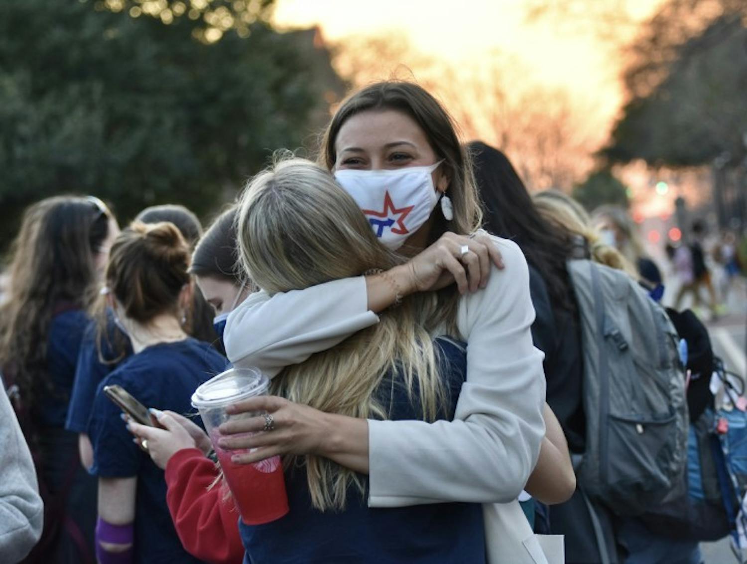 Candidate for treasurer, Kate Turner (right), embraces the new student body vice president-elect, Emily Dengler, after the announcement of the Student Government election results. The presidential and treasurer elections will go on to a runoff.
