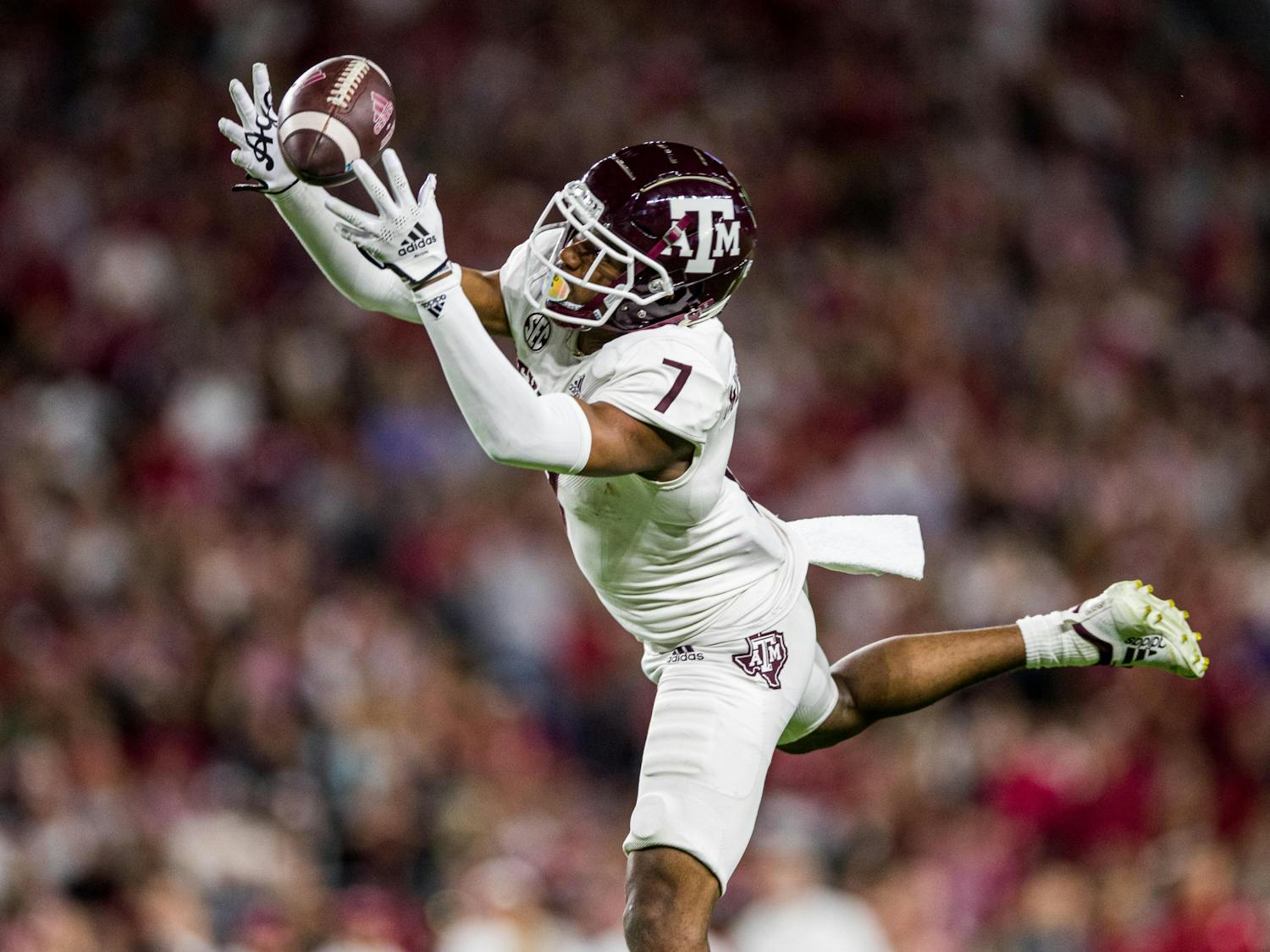 Sophomore wide receiver Moose Muhammad III reaching for the ball at Texas A&M's matchup against Miami on Sep. 17, 2022.