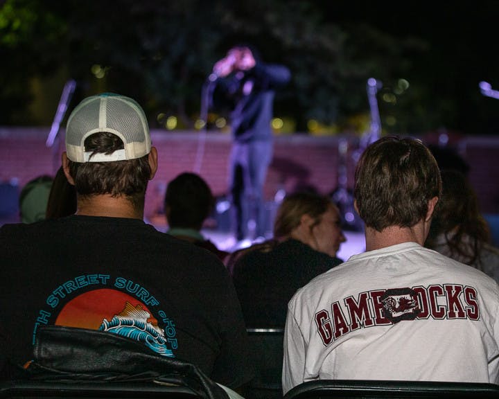 Students watch fourth-year sports and entertainment management student Joshua Jordan, a.k.a. the Gamecock Rapper, perform his set at the Battle of the Bands on Oct. 5, 2022. &nbsp;The competition brought a cappella, folk, rap and rock to the Russel House Patio in a variety of performances.&nbsp;