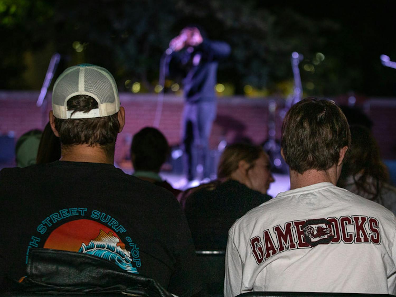 Students watch fourth-year sports and entertainment management student Joshua Jordan, a.k.a. the Gamecock Rapper, perform his set at the Battle of the Bands on Oct. 5, 2022. &nbsp;The competition brought a cappella, folk, rap and rock to the Russel House Patio in a variety of performances.&nbsp;