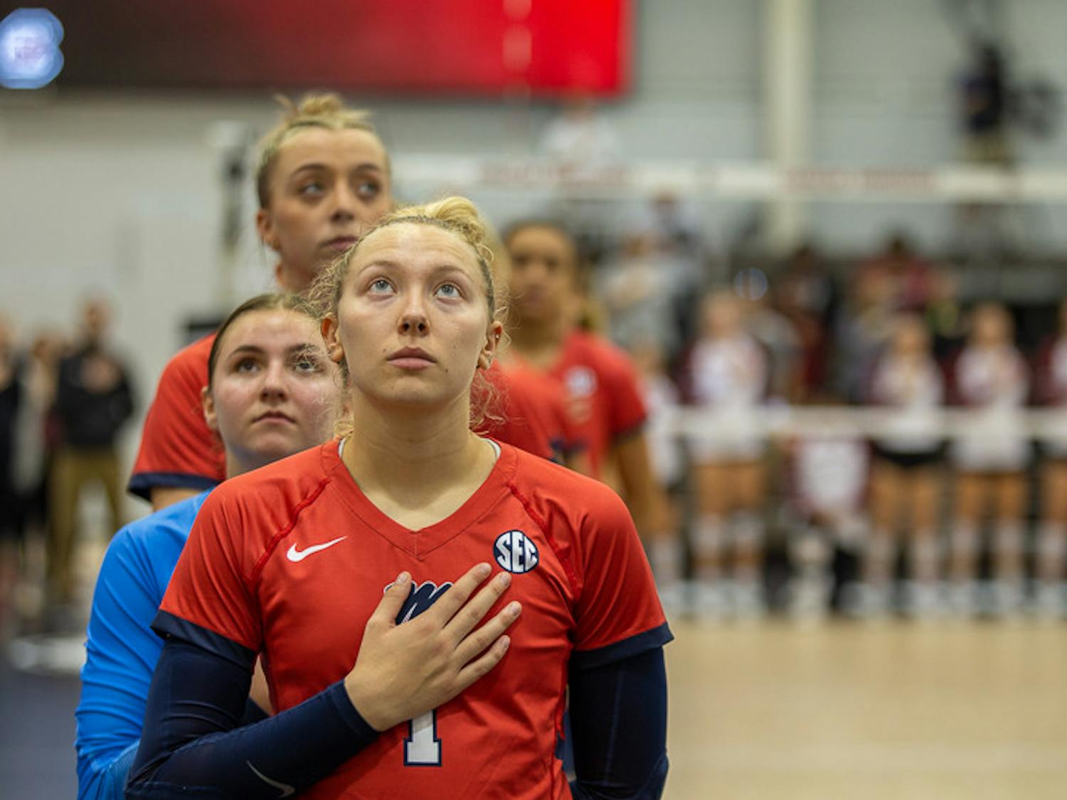 Ole Miss sophomore libero Bailee Middleton puts her hand on her heart during the national anthem at the start of the South Carolina and Ole Miss matchup on Nov. 5, 2022. Ole Miss beat South Carolina 3-1 in the first game of the two-game series.