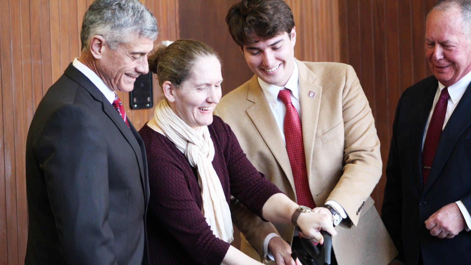 University President Bob Caslen, Student Body President Luke Rankin, and University Libraries Associate Dean for Collections Miranda Bennett cut the ribbon in Thomas Cooper Library. The ceremony is highlighting the renovated Level 4 of the library.