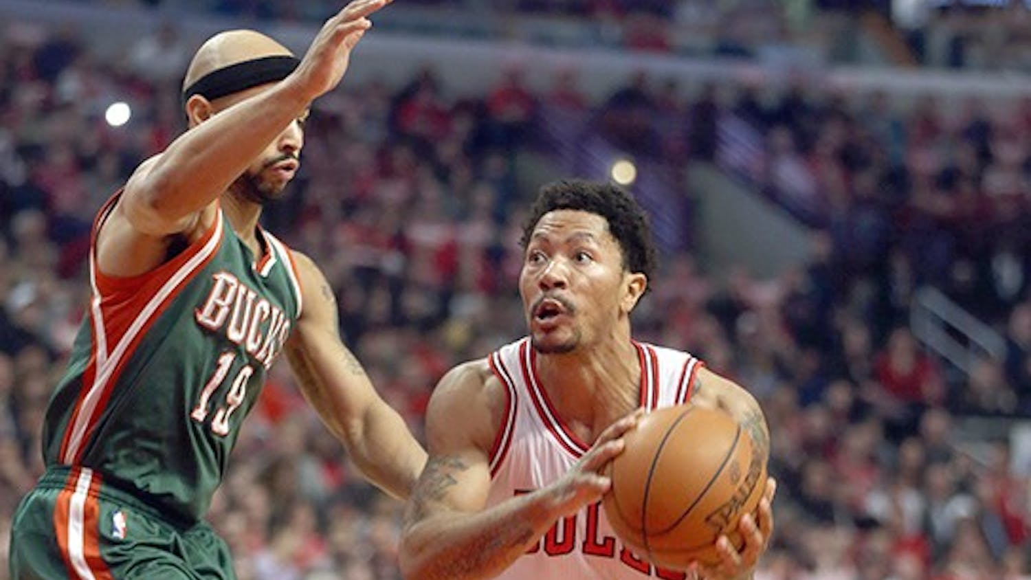 Chicago Bulls guard Derrick Rose (1) drives on Milwaukee Bucks guard Jerryd Bayless (19) during the first half on Monday, April 20, 2015, at the United Center in Chicago. (Brian Cassella/Chicago Tribune/TNS)