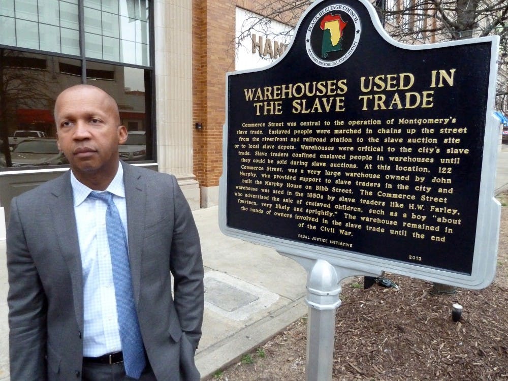 Bryan Stevenson is a Harvard-educated black lawyer who over three decades has worked to help release 115 men from death row, after proving they were prejudicially convicted. Now his nonprofit Equal Justice Initiative in Montgomery, Ala. has a new goal: to place memorial markers at some of the 4,000 lynching sites across the south. Here, Brian stands outside the building, where he has erected a sign calling attention to the site's role as a  southern slave auction. (John M. Glionna/Los Angeles Times/TNS)