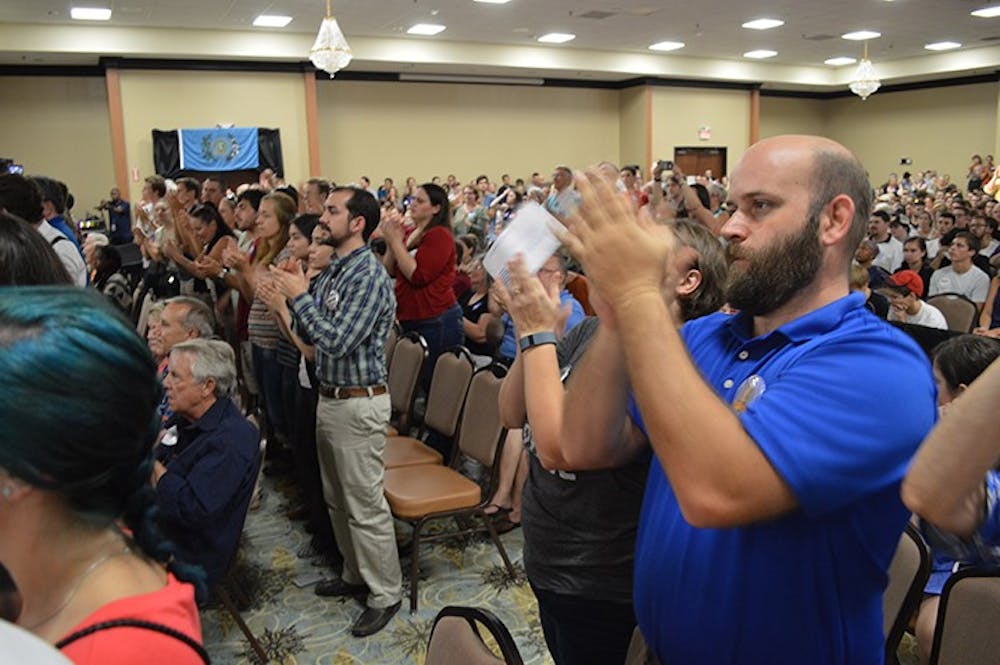 <p>Supporters, young and old, applaud as Senator Bernie Sanders speaks in Columbia, SC on Friday, August 21.</p>