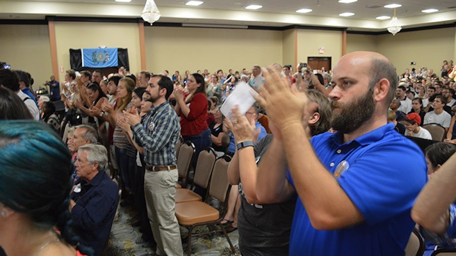 Supporters, young and old, applaud as Senator Bernie Sanders speaks in Columbia, SC on Friday, August 21.