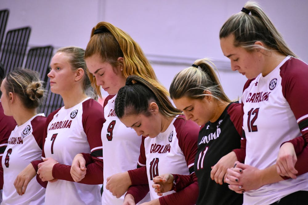 <p>FILE — The South Carolina volleyball team holds arms together for a moment in preparation of their game against Mississippi State on Oct.19, 2022. &nbsp;Following a loss against the Arkansas Razorbacks on Nov. 3, 2022, South Carolina falls to a record of 10-11 overall and 4-7 in SEC play.&nbsp;</p>