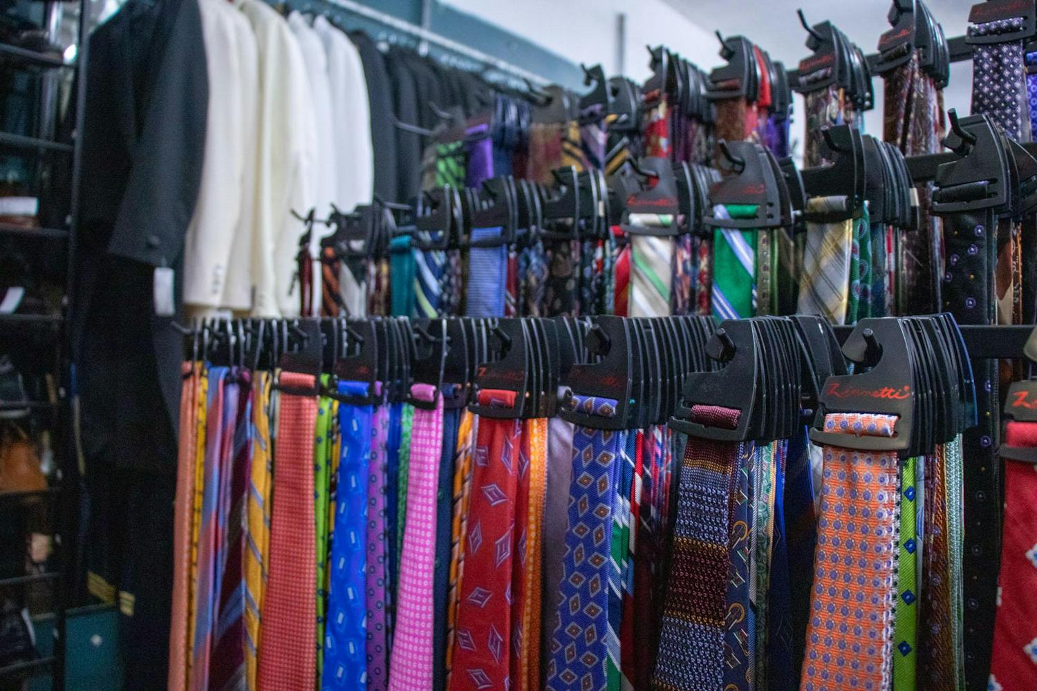 An assortment of ties hang on display inside the Gentleman's Closet consignment shop in Five Points on Jan. 30, 2024. The shop sources many of its ties from other men’s clothing stores that are replacing out-of-season clothes.