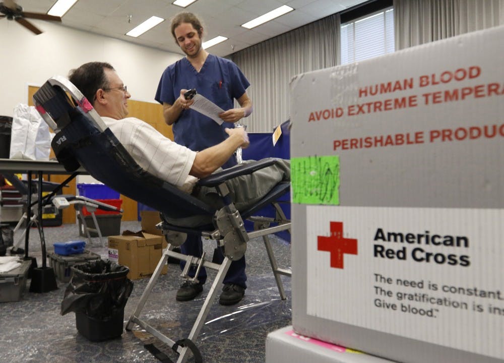 From left, state employee David Wainwright gives identifying information to American Red Cross phlebotomist Chris Culpepper on Wednesday, July 6, 2016 before beginning his blood donation in the NCDENR ground floor hearing room during a four-hour Red Cross blood drive in the Archdale Building on the Legislative mall in Raleigh, N.C. The usual summer shortage of blood donations has prompted the Red Cross to release an emergency call for more blood donations. (Harry Lynch/Raleigh News &amp; Observer/TNS)