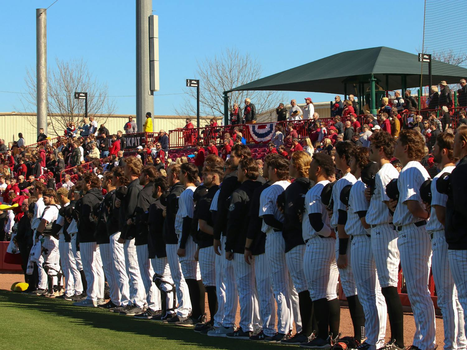 South Carolina baseball lines up for the national anthem prior to the start of their game against UMass Lowell at Founders Park on Feb. 18, 2023. The Gamecocks won 17-1 in the second game of a three-game series. &nbsp;