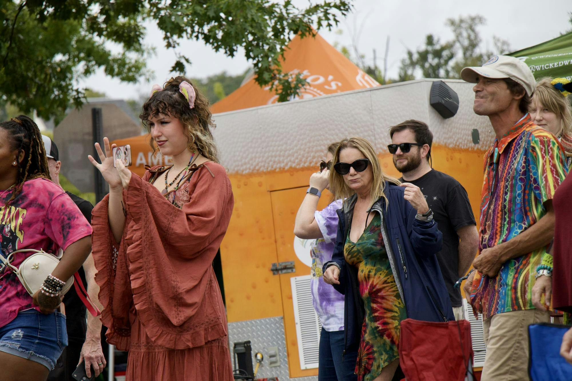 2022 University of South Carolina Alumna Sophia Dow records the Stillhouse musical performance. Living in the Columbia area, she manages the largest sponsor of JerryFest: Loose Lucy’s, which brought the festival to Columbia and is now in its 33rd year of business.