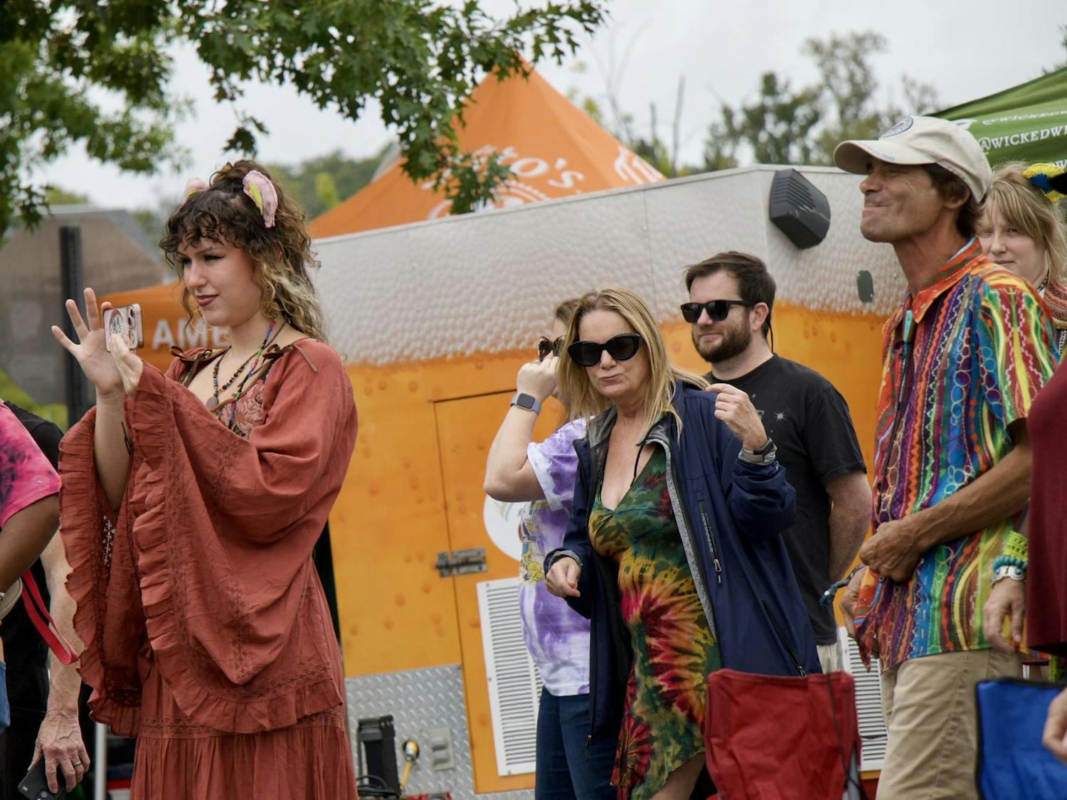 2022 University of South Carolina Alumna Sophia Dow records the Stillhouse musical performance. Living in the Columbia area, she manages the largest sponsor of JerryFest: Loose Lucy’s, which brought the festival to Columbia and is now in its 33rd year of business.