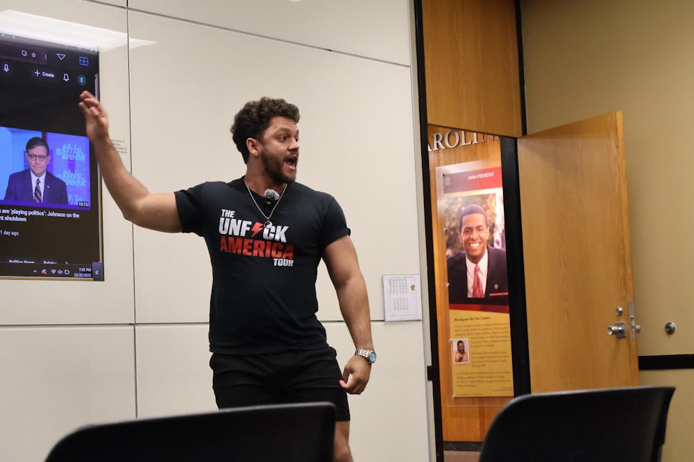 <p>National Ground Game communication administrator Ethan Alexander speaks to several students at the organization’s interest meeting at USC. </p>
