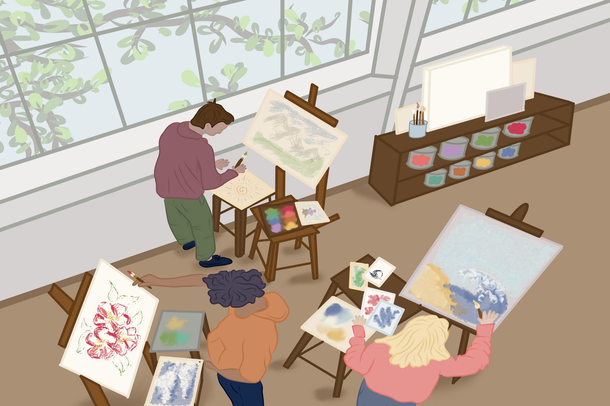 3 students painting on easels in an art room by a wall of windows