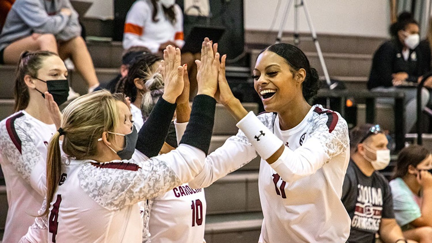 Senior Lauren Bowers high-fives senior Mikayla Robinson after Robinson scores a point. The Gamecocks defeated the Winthrop Eagles in three straight sets. &nbsp;