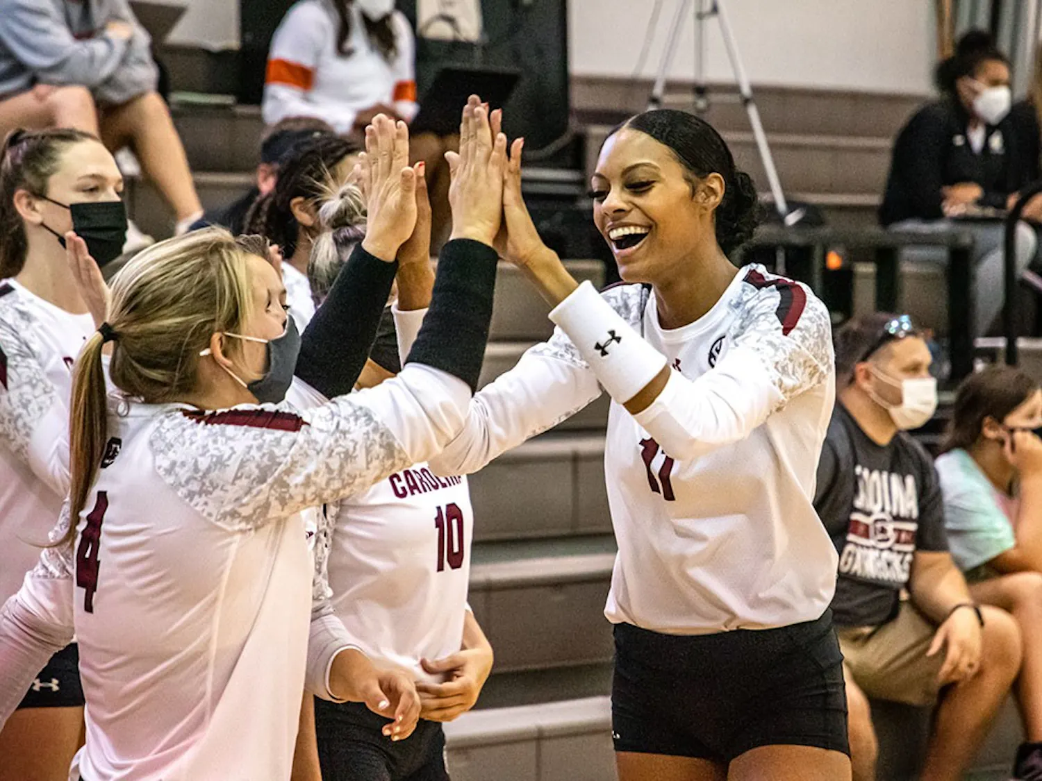 Senior Lauren Bowers high-fives senior Mikayla Robinson after Robinson scores a point. The Gamecocks defeated the Winthrop Eagles in three straight sets. 