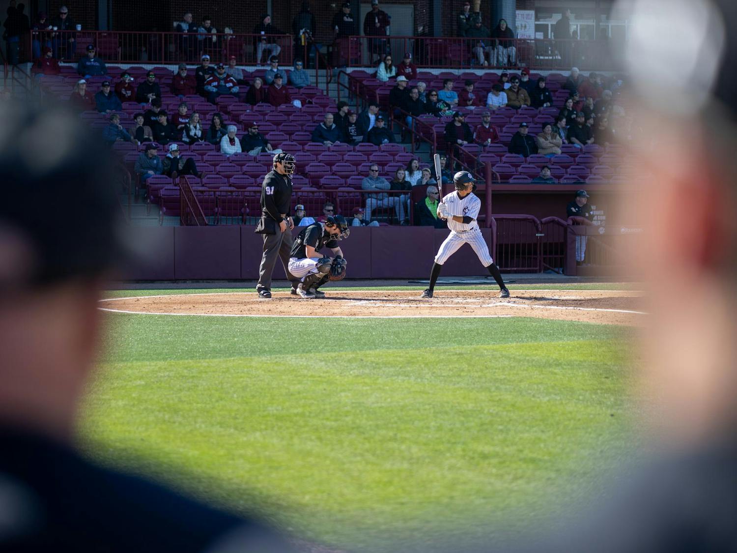 Senior infielder Jordan Carrion prepares to receive a pitch during an at-bat against Milwaukee on Feb. 22, 2025 at Founders Park. Carrion had three at-bats during the game, recording two hits and one RBI.