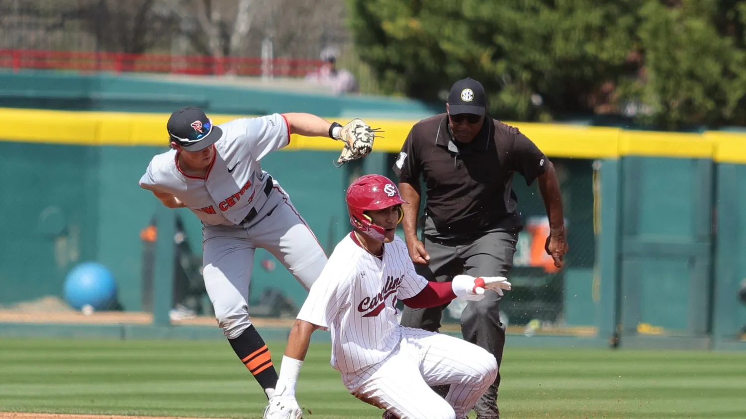 Senior outfielder Ethan Lizama slides into second base during South Carolina’s game against Princeton at Founders Park on March 7, 2026. The umpire watches closely as the play is made at the bag.