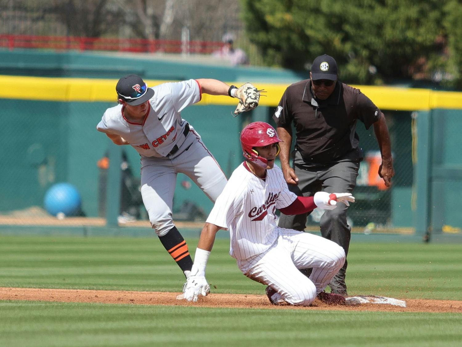 Senior outfielder Ethan Lizama slides into second base during South Carolina’s game against Princeton at Founders Park on March 7, 2026. The umpire watches closely as the play is made at the bag.